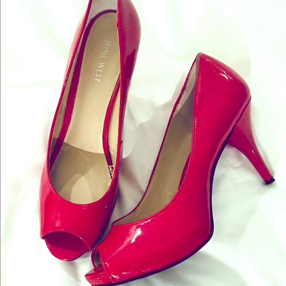 Red patent leather peep toe pumps